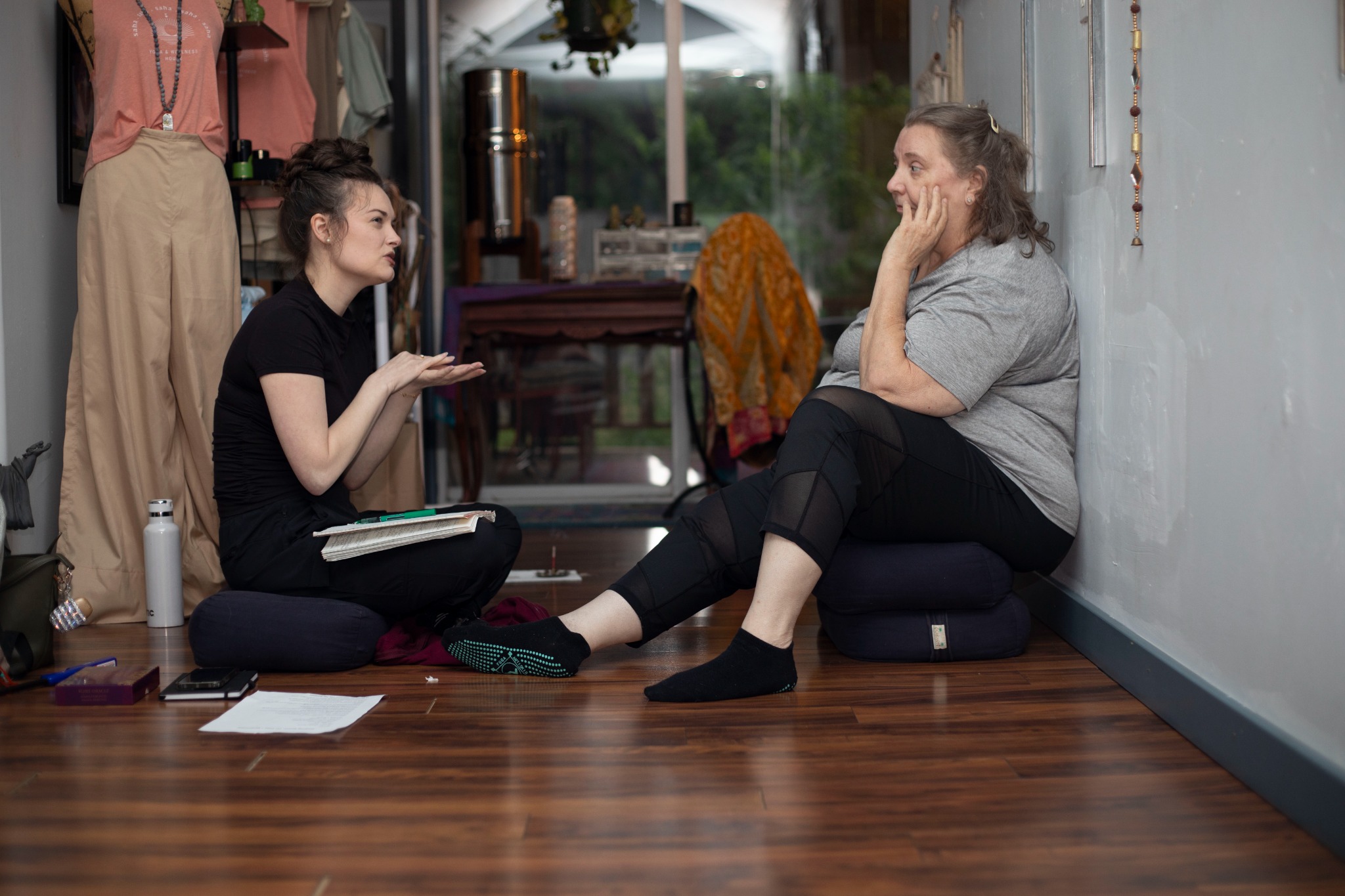 Two women sitting together in warm conversation