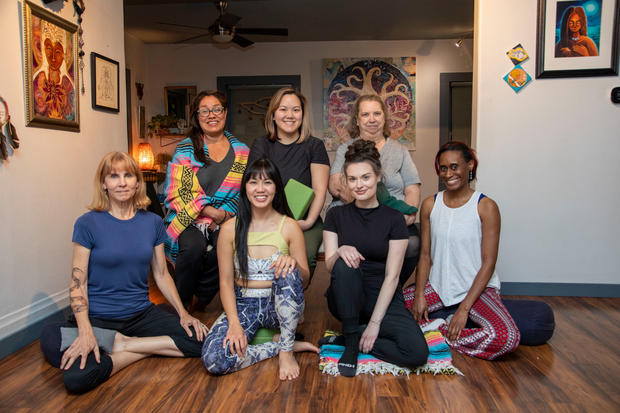 A small, intimate group gathered together in the studio